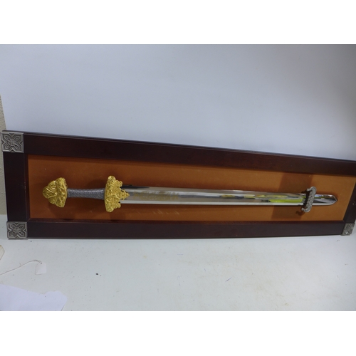 317 - A REPLICA 'TREASURE SWORD OF THE VIKINGS' SWORD, MOUNTED ON A WOODEN FRAME, 77CM, DOUBLE EDGED BLADE... 