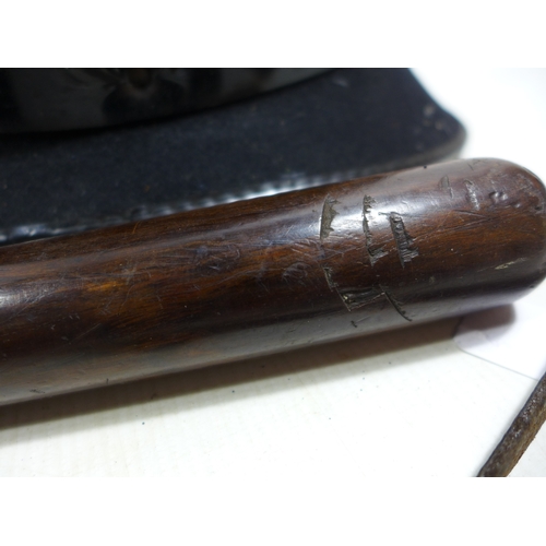 335 - A WORLD WAR I WHISTLE DATED 1915, HARDWOOD POLICE TRUNCHEON, LENGTH 38CM AND A POLICE HELMET (3)