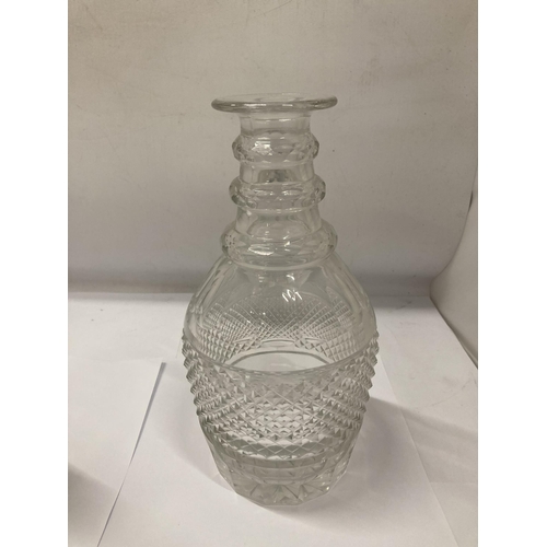 129 - A GLASS DECANTER AND A SUGAR SIFTER WITH PLATED LID