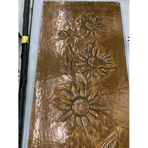 153 - AN ARTS AND CRAFTS COPPER PANEL, WITH WOODEN BACK AND FLORAL DESIGN, 30CM X 88CM