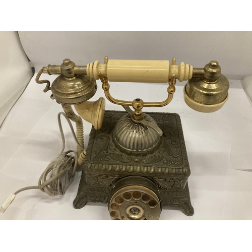 156 - A HEAVY VINTAGE BRASS ORNATE TELEPHONE