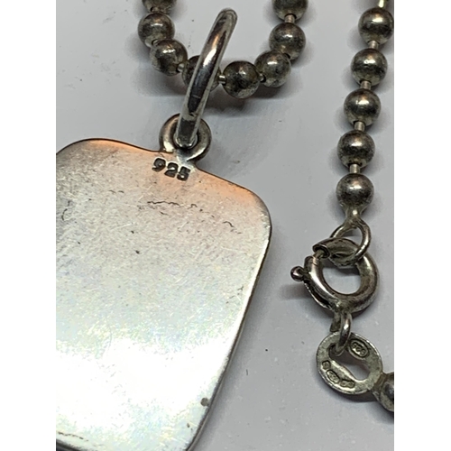 619 - A SILVER INGOT AND NECKLACE IN A PRESENTATION BOX