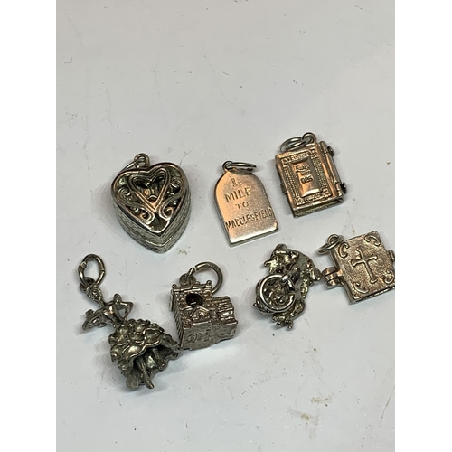 639 - TEN VARIOUS SILVER CHARMS