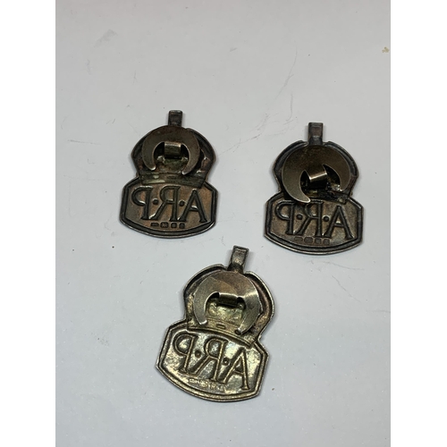 644 - THREE HALLMARKED LONDON SILVER ARP BADGES