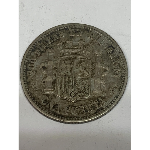 310 - AN 1869 SPANISH ONE PESETA SILVER COIN, BELIEVED VF