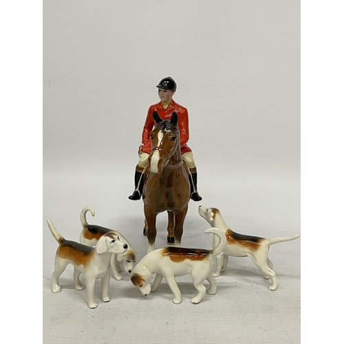 758 - A BESWICK HUNTSMAN ON BROWN HORSE STANDING BROWN GLOSS WITH FOUR HOUNDS