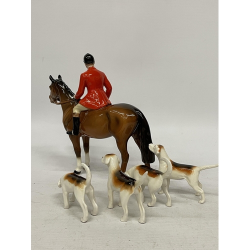 758 - A BESWICK HUNTSMAN ON BROWN HORSE STANDING BROWN GLOSS WITH FOUR HOUNDS