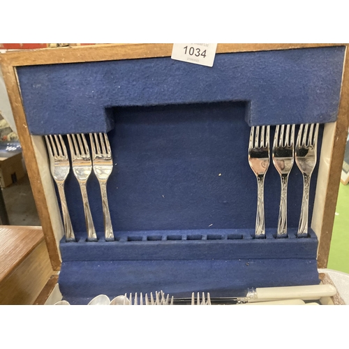 1034 - A VINTAGE WOODEN CASED SET OF FLATWARE