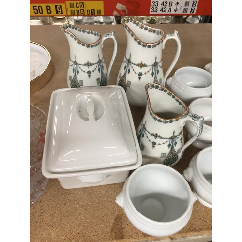 1055 - THREE GRADUATED LYONS JUGS, SOUP BOWLS AND A SERVING DISH