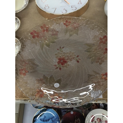 1056 - A LARGE FLORAL PATTERNED GLASS PLATE PLUS A WALL CLOCK