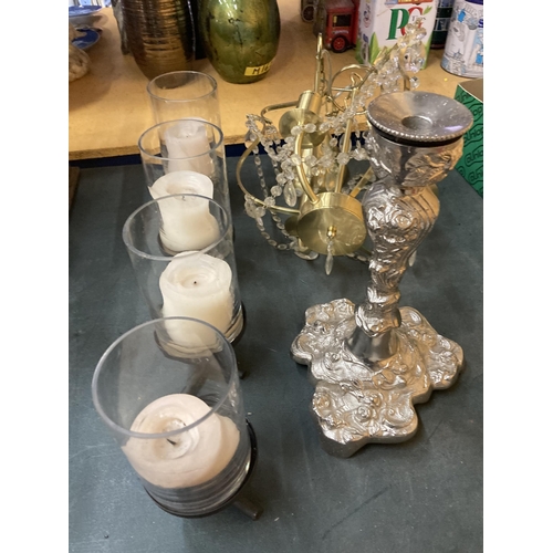 820 - A LARGE METAL CANDLE HOLDER HOLDING FOUR LARGE CANDLES IN GLASS HOLDERS, A LARGE SILVER COLOURED CAN... 