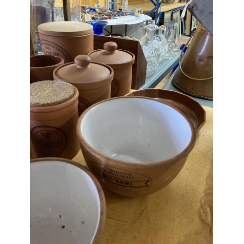 881 - A LARGE COLLECTION OF TERRACOTTA STORAGE JARS AND BOWLS, THE MAJORITY BY HENRY WATSON POTTERY