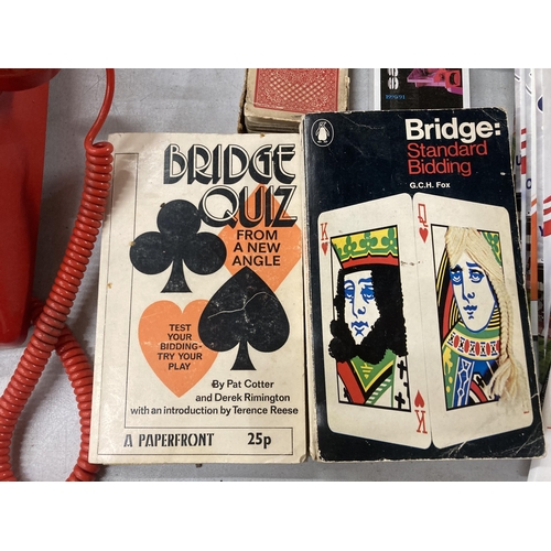 902 - ELEVEN VINTAGE PACKS OF PLAYING CARDS AND FOUR BRIDGE BOOKS