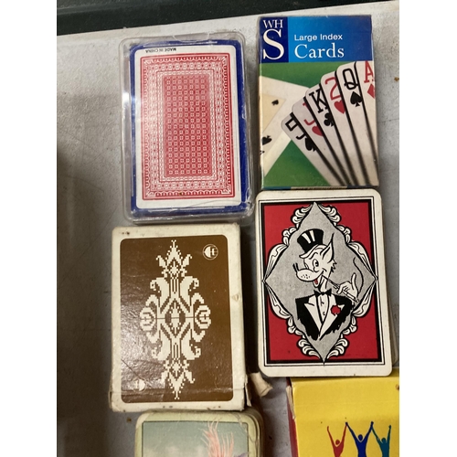 902 - ELEVEN VINTAGE PACKS OF PLAYING CARDS AND FOUR BRIDGE BOOKS