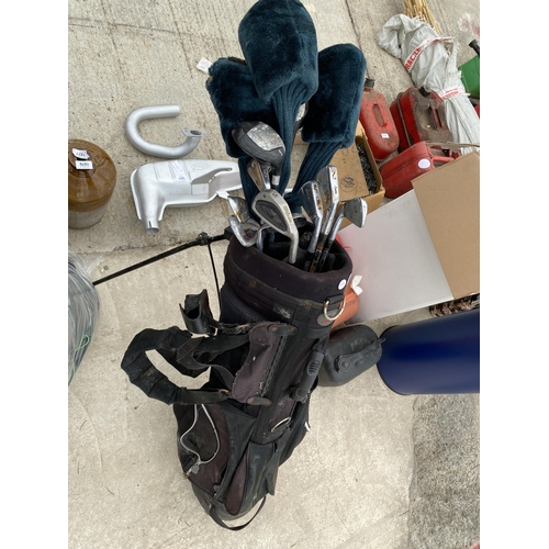 2038 - A GOLF BAG AND AN ASSORTMENT OF GOLF CLUBS