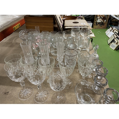 1101 - A LARGE QUANTITY OF GLASSES TO INCLUDE CHAMPAGNE FLUTES, BRANDY BALLOONS, WINE, SHERRY, TANKARDS, ET... 