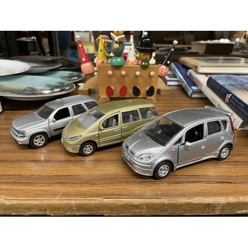 1112 - THREE DIE-CAST CARS TO INCLUDE A MITSUBISHI COLT