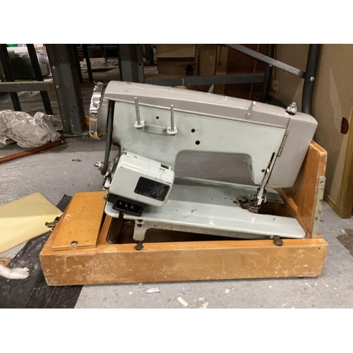 1129 - A VINTAGE LMR SEWING MACHINE IN CASE