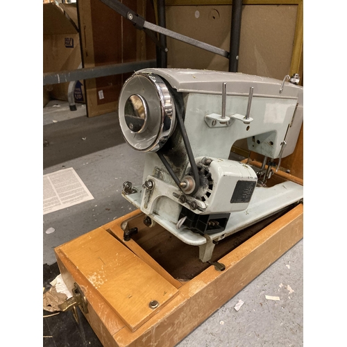 1129 - A VINTAGE LMR SEWING MACHINE IN CASE