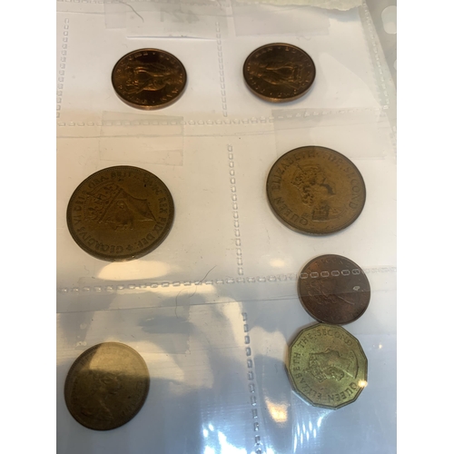 421 - TWENTY ASSORTED WORLD COINS BELIEVED TO CONTAIN- ISLE OF MAN, JERSEY ETC, DATES RANGING 1935-1984