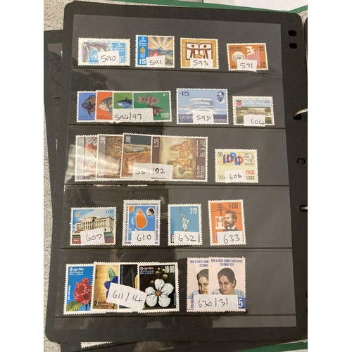 471 - A FOLDER CONTAINING SAUDI ARABIAN, CEYLON, SRI LANKA, SINGPORE AND SIRIYAN STAMPS