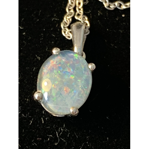 513 - A SILVER NECKLACE WITH A PALE BLUE OPAL STYLE PENDANT IN A PRESENTATION BOX