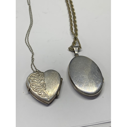 649 - TWO SILVER NECKLACES WITH LOCKETS TO INCLUDE A HEART SHAPED AND OVAL