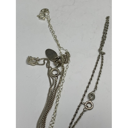 660 - FOUR SILVER NECKLACES WITH PENDANTS