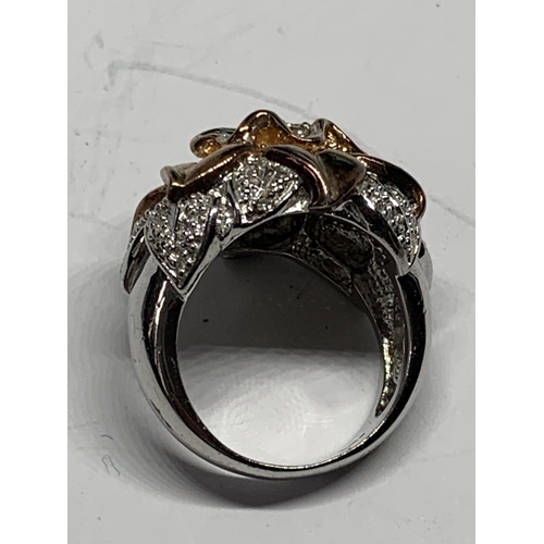 687 - A SILVER DESIGNER RING WITH A COPPER COLOURED FLOWER DESIGN SIZE N IN A PRESENTATION BOX