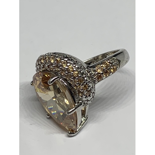 690 - A SILVER RING WITH LARGE AMBER STONE SIZE J/K IN A PRESENTATION BOX