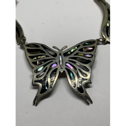 694 - A LARGE SILVER BUTTERFLY NECKLACE WITH MOTHER OF PEARL INLAY