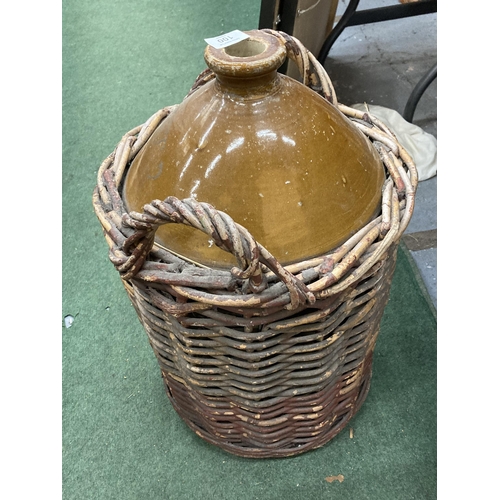 100 - A LARGE F T MORRELL & CO 105-107 GT ANCOATS STREET MANCHESTER STONEWARE VESSEL IN A WICKER BASKET