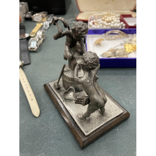 149A - A PEWTER FIGURE OF A BLACKSMITH ON BASE