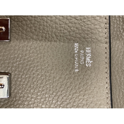 259 - A TAUPE COLOURED PURSE MARKED 'HERMES' WITH DUST COVER AND BOX