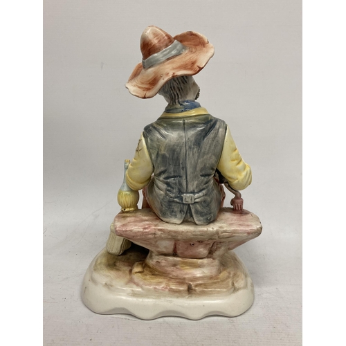 753 - A CAPODIMONTE FIGURE OF A MAN ON A BENCH WITH A CAT