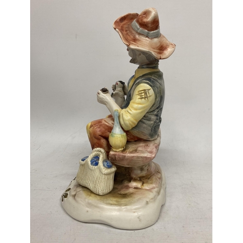 753 - A CAPODIMONTE FIGURE OF A MAN ON A BENCH WITH A CAT