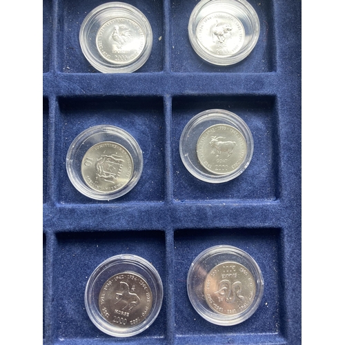 354A - SOMALIA , A SELECTION OF 12 ENCAPSULATED TEN SHILLING COINS FROM 2000