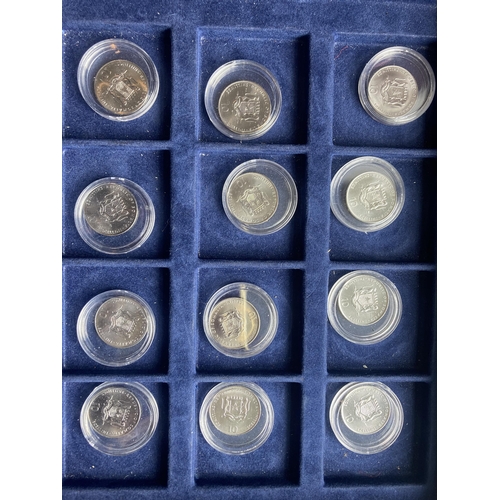 354A - SOMALIA , A SELECTION OF 12 ENCAPSULATED TEN SHILLING COINS FROM 2000