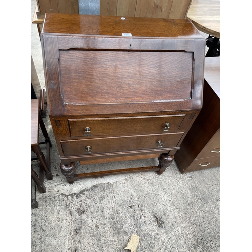 2963 - AN EARLY 20TH CENTURY OAK BUREAU ON OPEN BASE, 28