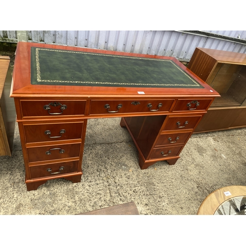 2975 - A MODERN YEW WOOD TWIN PEDESTAL DESK WITH INSET LEAHTER TOP, ENCLOSING EIGHT DRAWERS, 48 X 24