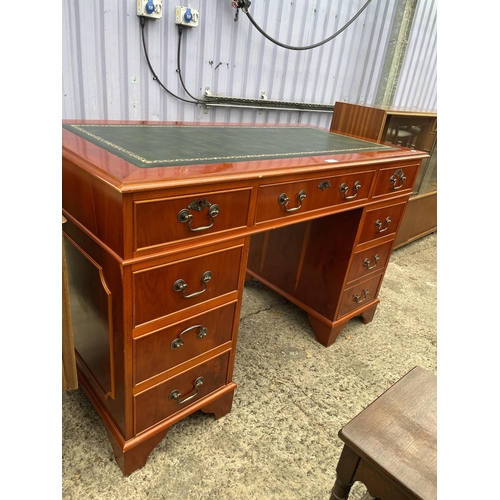 2975 - A MODERN YEW WOOD TWIN PEDESTAL DESK WITH INSET LEAHTER TOP, ENCLOSING EIGHT DRAWERS, 48 X 24