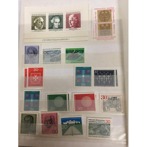 427A - THREE ALBUMS OF GERMAN STAMPS AND SOME LOOSE EXAMPLES