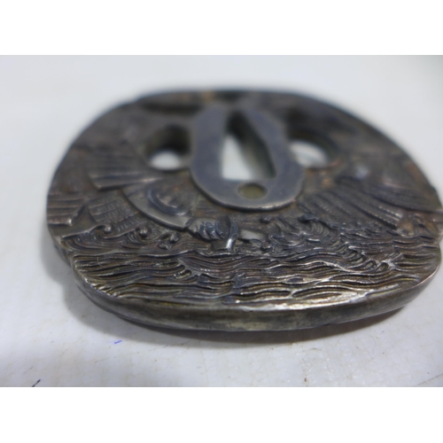 345 - A JAPANESE WHITE METAL TSUBA DECORATED WITH SAMURAI, DIAMETER 8CM