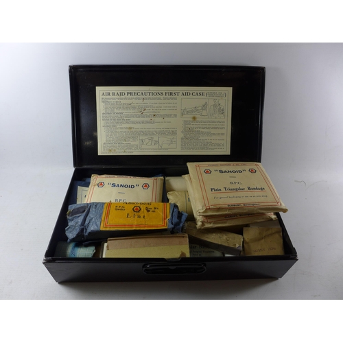 356 - A BLACK PAINTED WORLD WAR II A.R.P. HOME FIRST AID KIT, COMPLETE WITH BANDAGES ETC