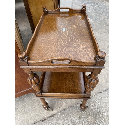 2576 - AN EARLY 20TH CENTURY OAK TWO TIER DINNER TROLLEY WITH LIFT-OUT TRAY