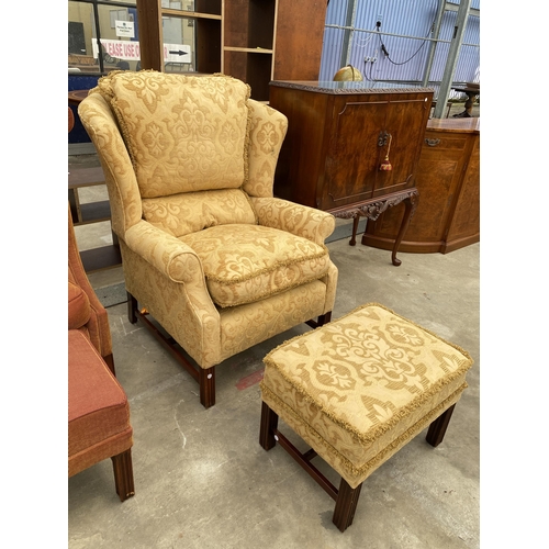 2584 - A GEORGE III STYLE SPRUNG AND UPHOLSTERED WINGED EASY CHAIR AND STOOL