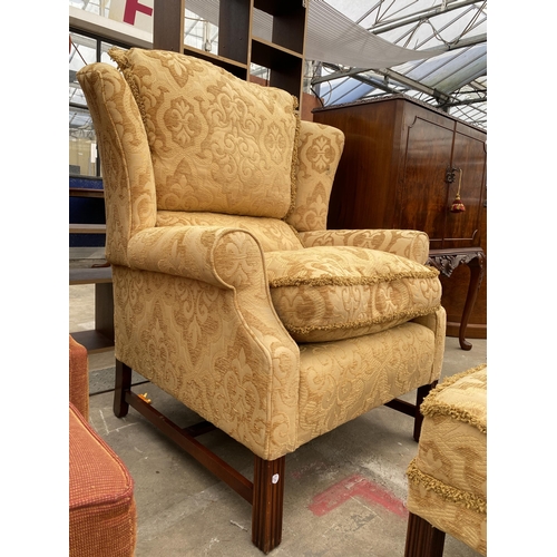 2584 - A GEORGE III STYLE SPRUNG AND UPHOLSTERED WINGED EASY CHAIR AND STOOL