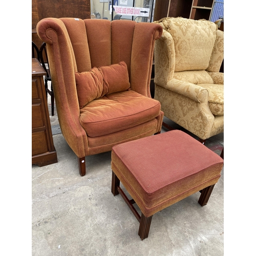 2585 - A GEORGE III STYLE SPRUNG AND UPHOLSTERED CARVED HIGH BACK EASY CHAIR AND STOOL