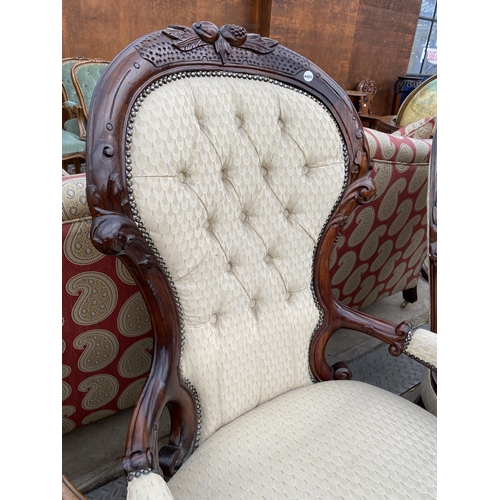 2588 - A VICTORIAN STYLE LADIES AND GENTLEMAN'S LOUNGE CHAIRS, ONE WITH OPEN ARMS, BOTH HAVING CARVING AND ... 