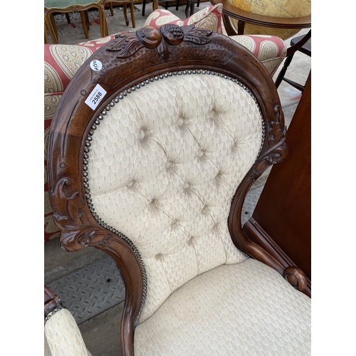 2588 - A VICTORIAN STYLE LADIES AND GENTLEMAN'S LOUNGE CHAIRS, ONE WITH OPEN ARMS, BOTH HAVING CARVING AND ... 